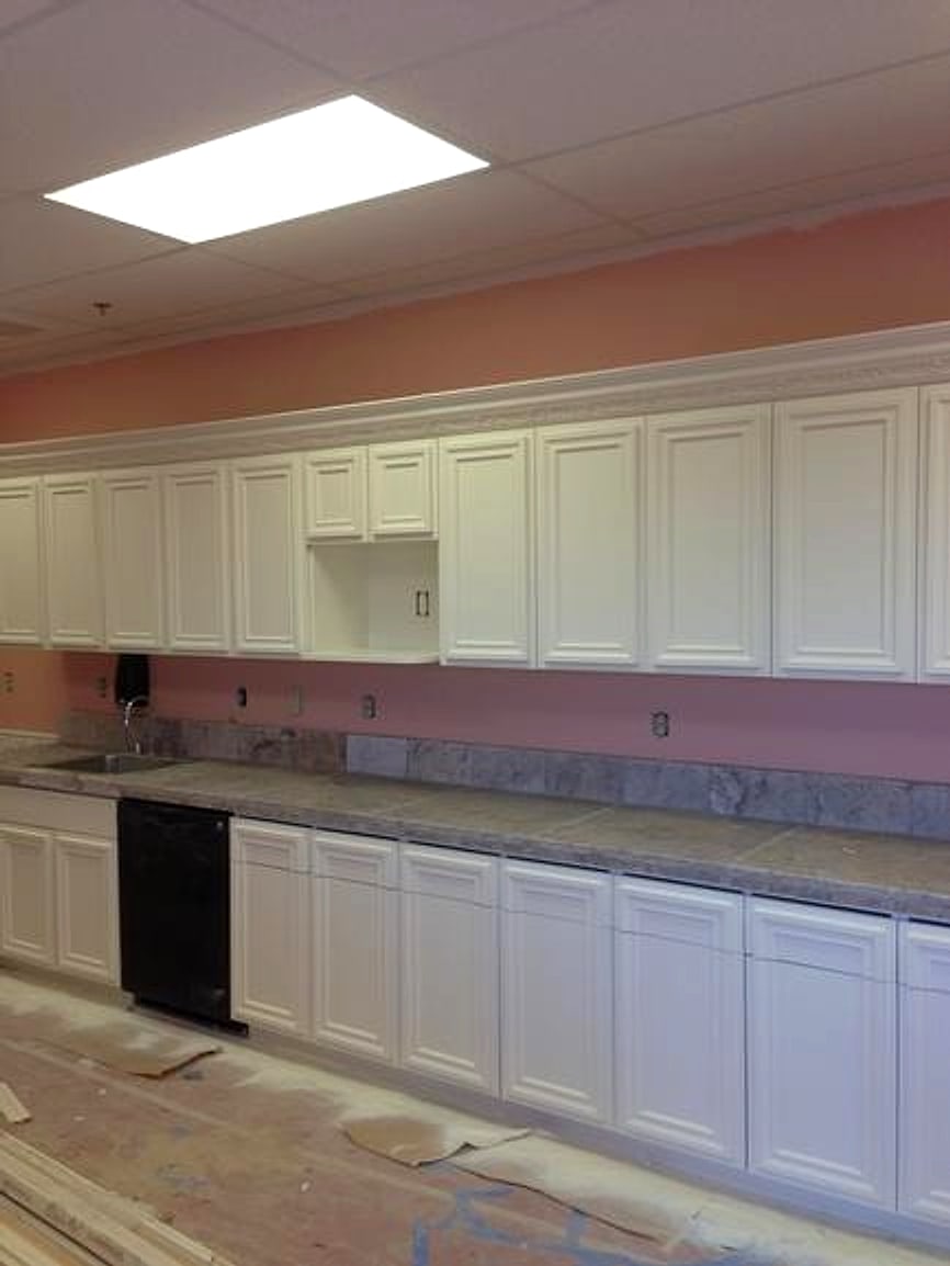 A second kitchen with its cabinets finished white