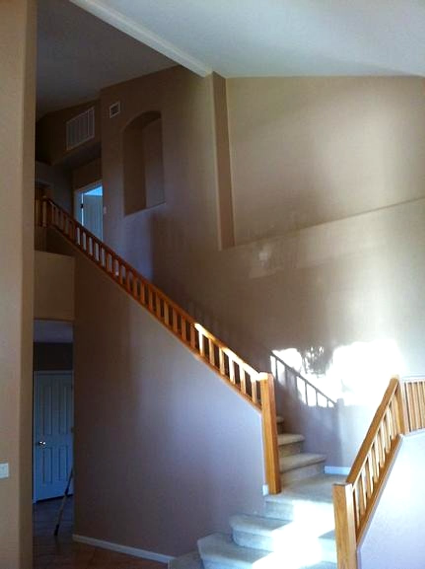 Freshly painted stairwell with tall walls